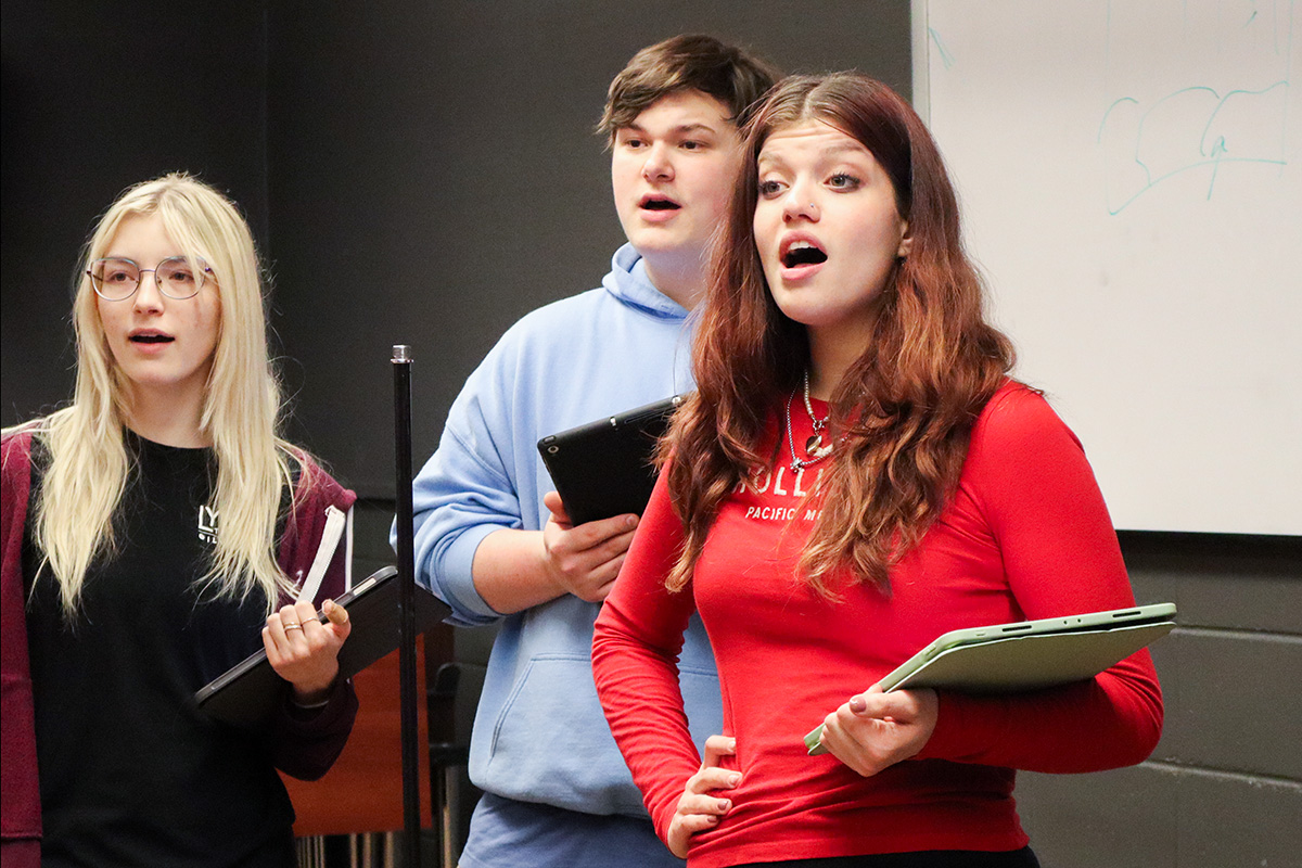 Three lyric theatre students singing