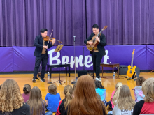 The internationally acclaimed duet ArcoStrum performed for students at Bement (IL) Elementary School in 2025 as part of Krannert Center's community engagement efforts. (Emily Laugesen, photo)